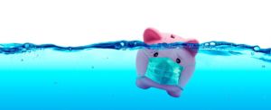 piggy bank drowning in water